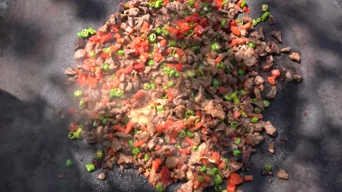 Top view of preparing delicious sac kavurma (a kind of Turkish kebab). Video stock 166019135