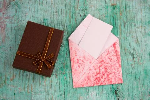 Top view present box and evelope with  white blank paper sheet with place for Stock Photos