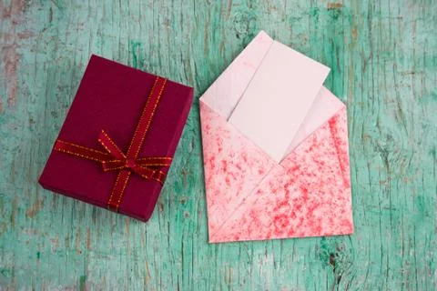 Top view present box and evelope with  white blank paper sheet with place for Stock Photos