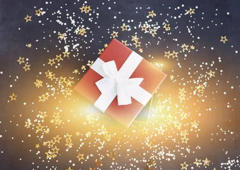 Top view of present wrapped in paper with red ribbon and placed on table with Stock Photos