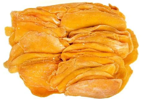 Top view of pressed dried mango slices on white background. Stock Photos