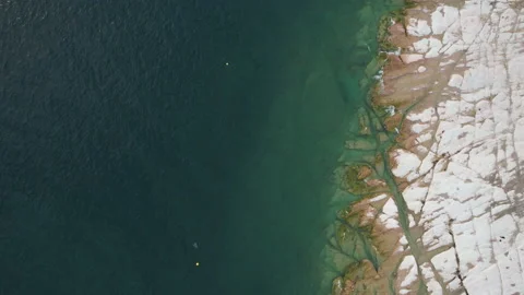Top view of previously underwater rocks in Sirmione along Garda Lake, Italy Stock Footage 220307289