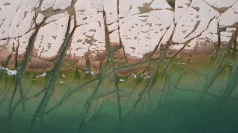 Top view of previously underwater rocks in Sirmione along Garda Lake, Italy Stock Footage 220308371