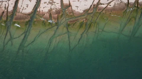 Top view of previously underwater rocks in Sirmione along Garda Lake, Italy Stock Footage 220308605