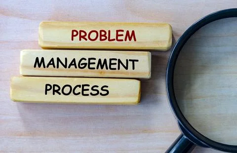 Top view of Problem Management Process text on wooden blocks with magnifyin.. Stock Photos