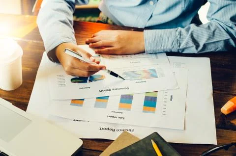Top view process close-up analyzing investment chart working in office. Busin Stock Photos