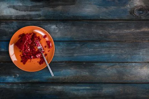 Top View. In the process of eating delicious Red velvet cake on a ceramic plate Stock Photos