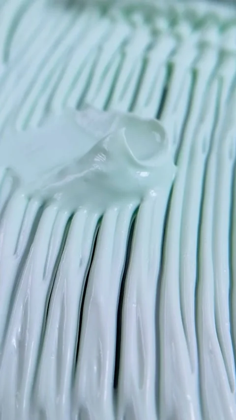 Top view process of smoothing wavy cream into an even flat layer. Beauty cr.. Stock Footage 339288815