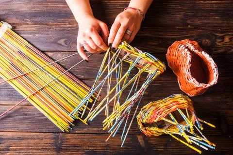 Top view of the process of weaving from paper Stock Photos