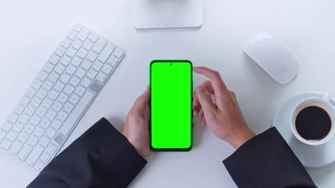 Top view of professional in suit using green screen smartphone at office Stock Footage 328552676