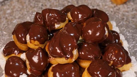 Top view of profiteroles with chocolate glaze Stock Footage 97975643