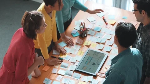 Top view of programmer brainstorming idea about phone interface. Symposium. Stock Footage 271200106