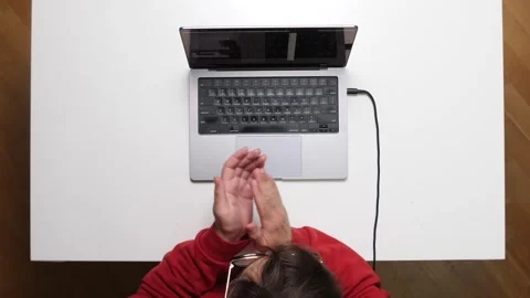 Top view Programmer clapping hands after finishing coding project on laptop Stock Footage 311202305