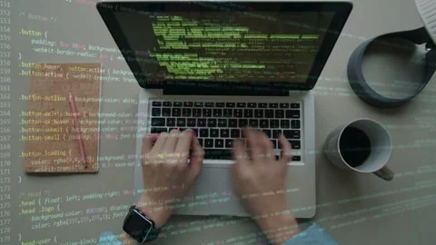 Top View of Programmer Typing with Green Code Overlay Stock Footage 335830430