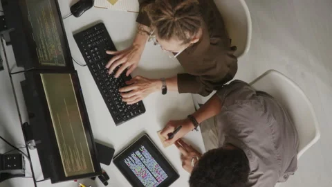 Top View of Programmers Couple Coding in Office Stock Footage 255782194
