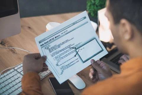 Top view of programming code written on paper Stockfoto's