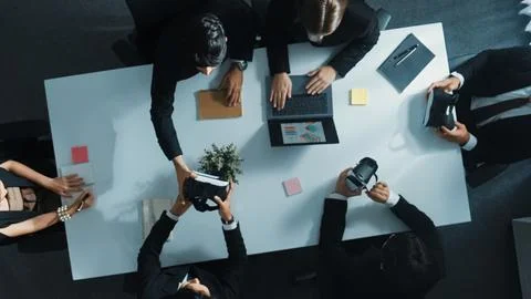 Top view of project manager give vr head set to businesspeople. Directorate. Stock Photos
