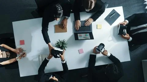 Top view of project manager give vr head set to businesspeople. Directorate. Stock Photos
