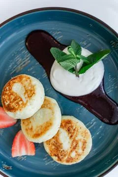 Top view of proper breakfast, baked curd pancakes Stock Photos