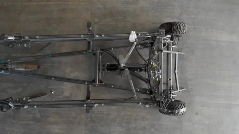 Top view of a prototype of metal plow for arable land in an industrial hangar Stock Footage 119835480
