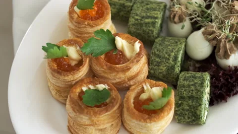 Top view of puff pastry with red caviar in the white plate with eggs and lettuce Stock Footage 132138497