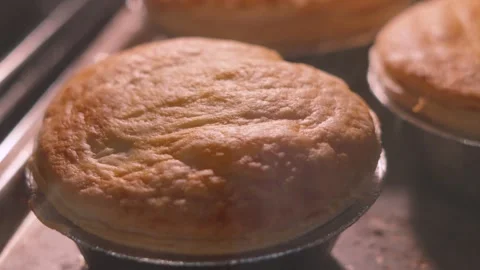 Top View of Puff Pastry on Top of Chicken and Vegetable Pie Cooking in Hot Oven. Stock Footage 337506113
