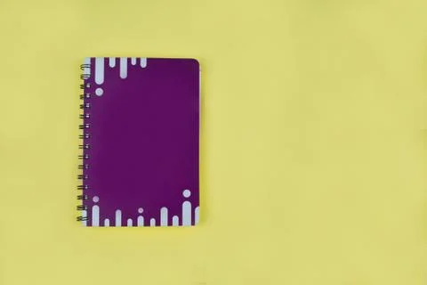 Top view of an purple note book diary with white stripes before a white backg Stock Photos