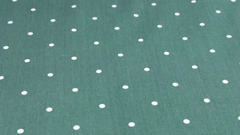 Top view of the queen blue with white polka dots cotton fabric rotated  Stock Footage 293880453