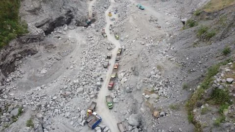 Top view of the queue of sand trucks in Kali Adem Stock Photos