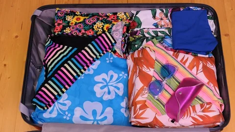 Top view quickly packing suitcase Stock Footage 123658061