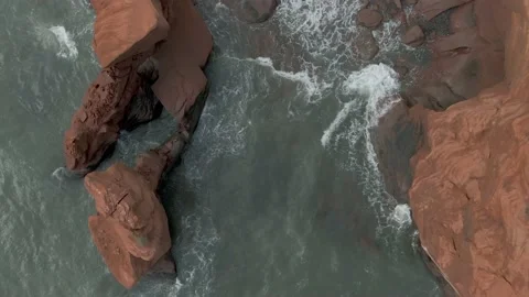 Top View Of Raging Waves Splashing On The Sea Stack By The Magdalen Stock Footage 139268075