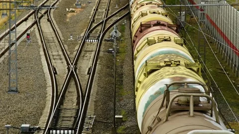 Top view of the railway tracks along which the freight train is moving. Видео 331206751