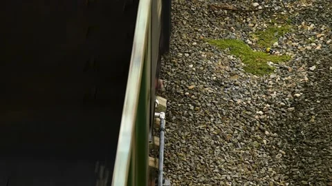 Top view of the railway tracks along which the freight train is moving. Stock Footage 339765691