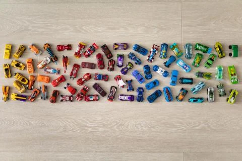 Top view random collection of model sport car toy hot wheels on wooden floor Stock Photos