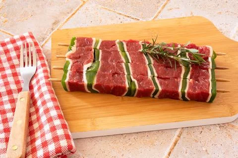 Top view of raw beef skewer on wooden board Stock Photos
