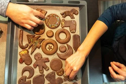 Top view of raw gingerbread biscuits, which are decorated with a young couple Stock Photos
