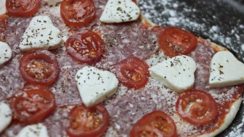 Top view of the raw heart shaped pizza on the baking tray. Preparing heart Stock Footage 146660911