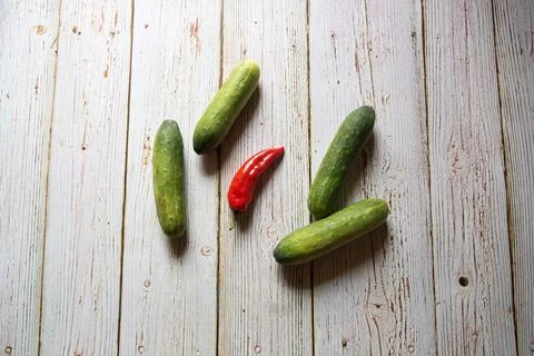 Top view of raw red chilli  and cucumbers Stock Photos