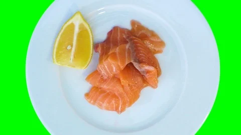 Top view, raw salmon, slices and lemon on a plate. The plate rotates. Healthy Stock Footage 111908060