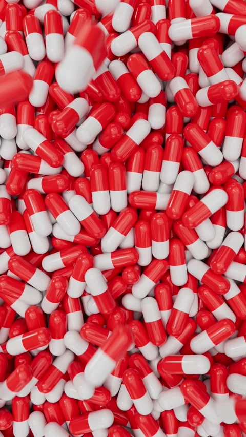 Top view of red and white pill capsules background Vidéo 330161991