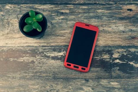 Top view of red android cellphone with a blank empty screen with copyspace Stock Photos