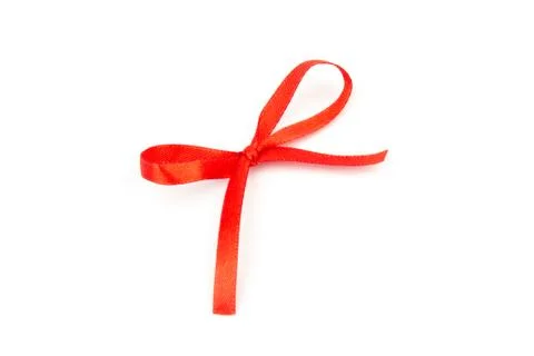 Top view of Red bow isolated shiny rolled on white background. Flat lay view. Stock Photos