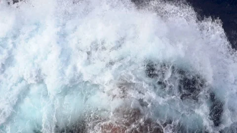Top view of red bow of the vessel cutting sea surface with foamy splashes. Stock Footage 140776037