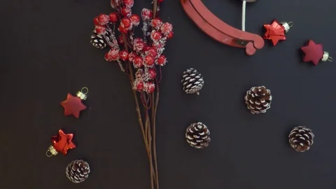 Top view red branch on a dark table with Christmas decoration Stock Footage 70007339