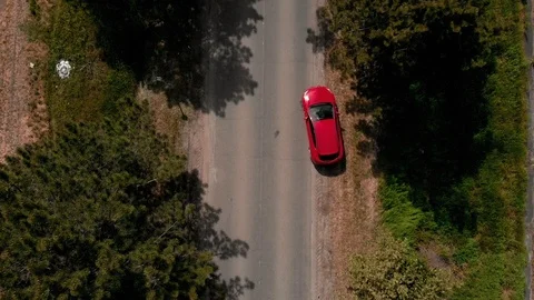 Top view of a red car moving on the road Stock Footage 121712939