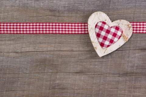 Top view of red checked heart decoration on wooden background - country style Stock Photos