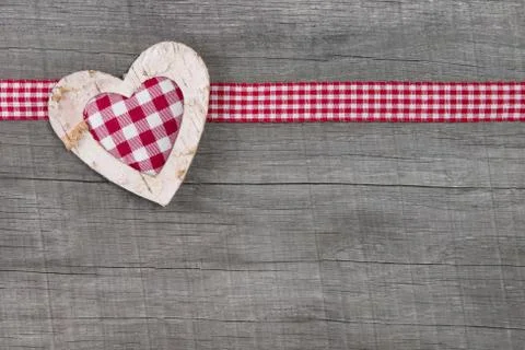 Top view of red checked heart decoration on wooden background - country style Stock Photos