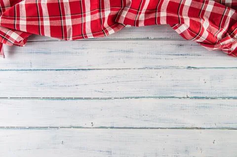 Top of view red checkered tablecloth on wooden table Stock Photos