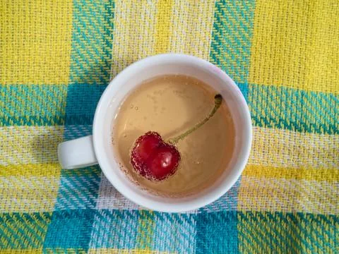 Top view of red cherry in a drink with vintage background. Stock Photos