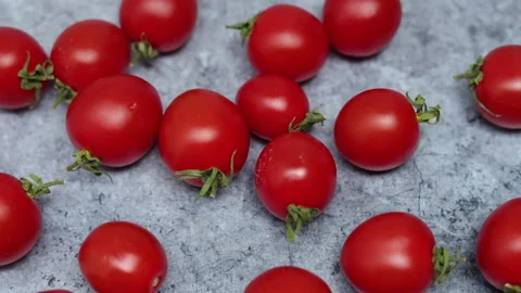 Top View Of Red Cherry Tomatoes On A Marble Background. Dolly Slider Shot. Vídeo Stock 150902328